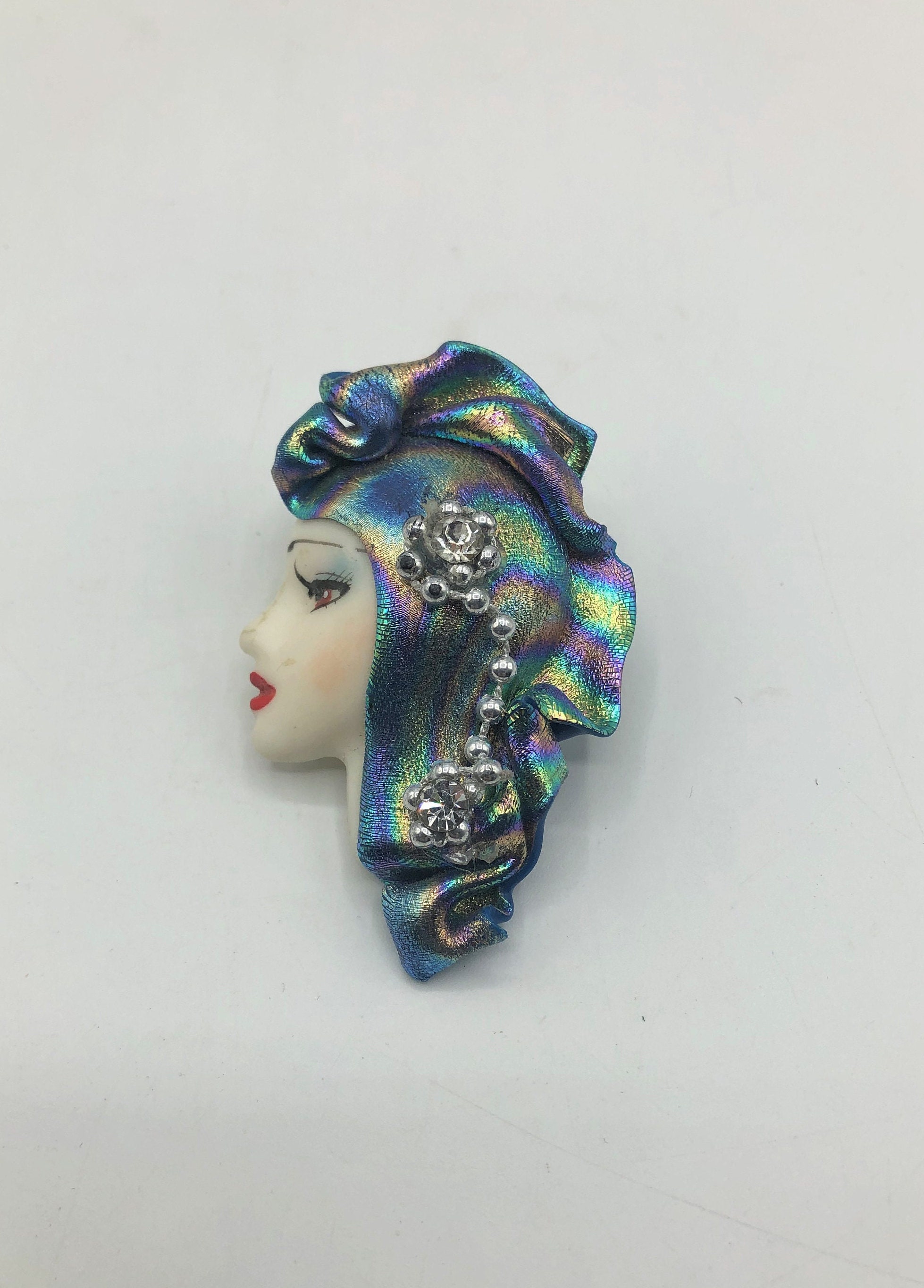 Brooch with woman's face deals
