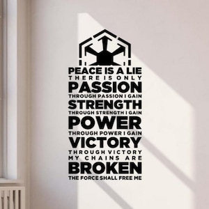 May include: A black and white wall decal featuring the Imperial symbol from Star Wars. The decal includes the text "Peace is a lie, there is only passion..." and other related phrases. The design is applied to a white wall.
