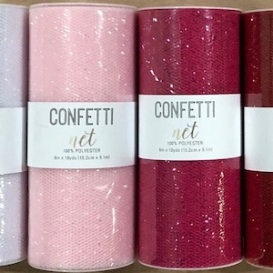 May include: Eight rolls of glitter tulle fabric in various colours, including white, pink, red, green, blue, and purple. Each roll has a label that reads "CONFETTI net 100% polyester 6 in x 10 yds (15.2 cm x 9.1 m)"