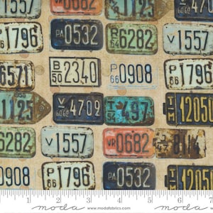 May include: A beige fabric with a repeating pattern of vintage license plates. The plates are in various colors and have different numbers and letters. Some of the plates are faded and worn, giving them a rustic look.