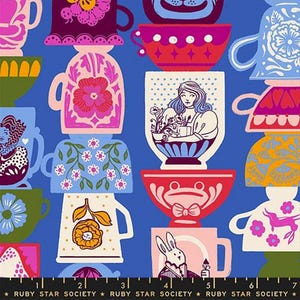 May include: A fabric pattern featuring stacked, colorful teacups and mugs on a blue background. The cups display floral, animal, and human illustrations. The text "RUBY STAR SOCIETY" is printed at the bottom.