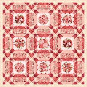 May include: A square quilt featuring a grid of nine floral bouquet blocks in shades of red, pink, and cream. The blocks are separated by patterned strips and small heart-shaped corner accents, all framed by a light cream border.
