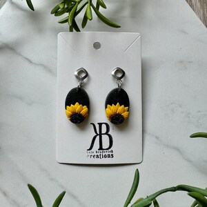Sunflower Hand Sculpted Bright Yellow and Orange Procut Sunnies with Black Background Polymer Clay Handmade Stainless Steel Dangle Earrings