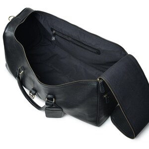 Interior view of leather weekender with compartments and lining