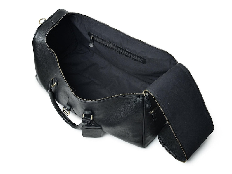 Interior view of leather weekender with compartments and lining