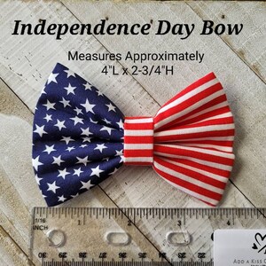 May include: A red, white, and blue bow tie with a star pattern on one side and stripes on the other. It measures 4 inches long and 2 3/4 inches high. Independence Day Bow.