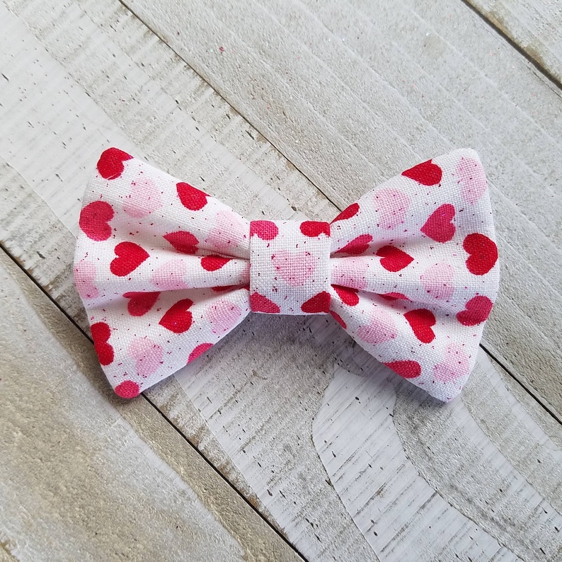 Infant Valentines Hair Bow with Hearts Skinny Nylon Headband or Clip Newborn Valentines Bow with Pink and Red Hearts and a touch of Glitter