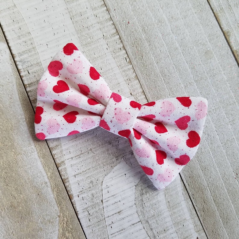 Infant Valentines Hair Bow with Hearts Skinny Nylon Headband or Clip Newborn Valentines Bow with Pink and Red Hearts and a touch of Glitter