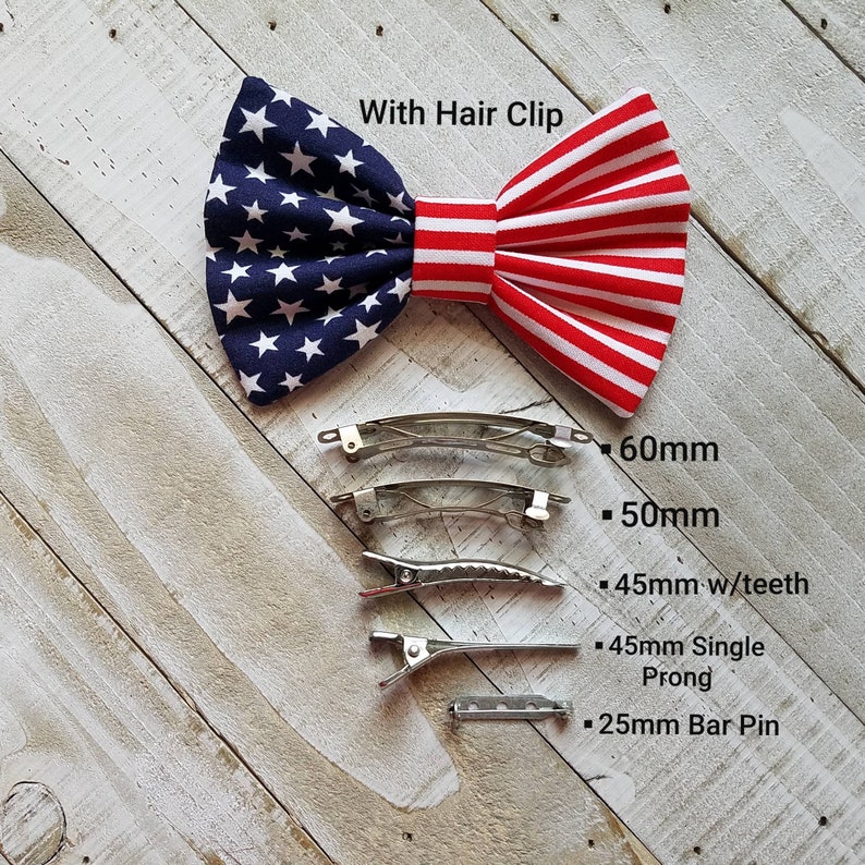May include: A red, white, and blue bow with stars and stripes, with the text "With Hair Clip".  The bow is shown with five different sizes of hair clips: 60mm, 50mm, 45mm with teeth, 45mm single prong, and 25mm bar pin.