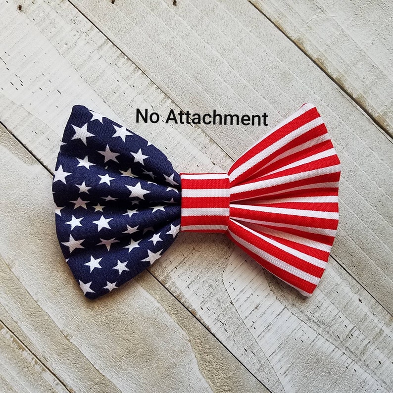 May include: A red, white, and blue bow tie with a stars and stripes pattern. The bow tie is made of fabric and has a no attachment option.