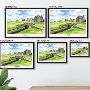 May include: Framed watercolor print of St Andrews, Scotland, featuring a stone bridge over a stream and a historic building under a blue sky. The print is available in various sizes, including 16x12 inches, 14x11 inches, and 8x6 inches.