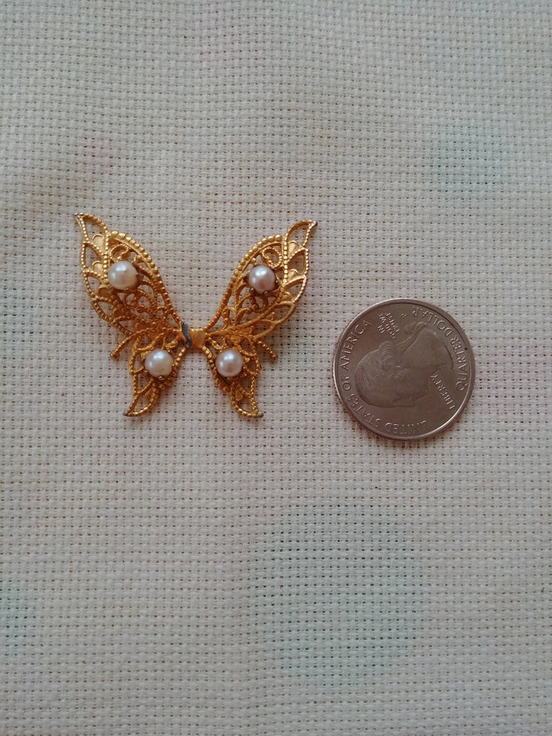 Needle Minder Medium Golden Metal Butterfly with Faux Pearls On The Wings and is Magnetic