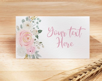 May include: A white card with a pink floral design and the text "Your text here" on a wooden plate with a wheat stalk.