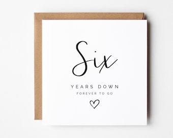 May include: White card with black text that reads "Six Years Down Forever To Go" with a small heart symbol.
