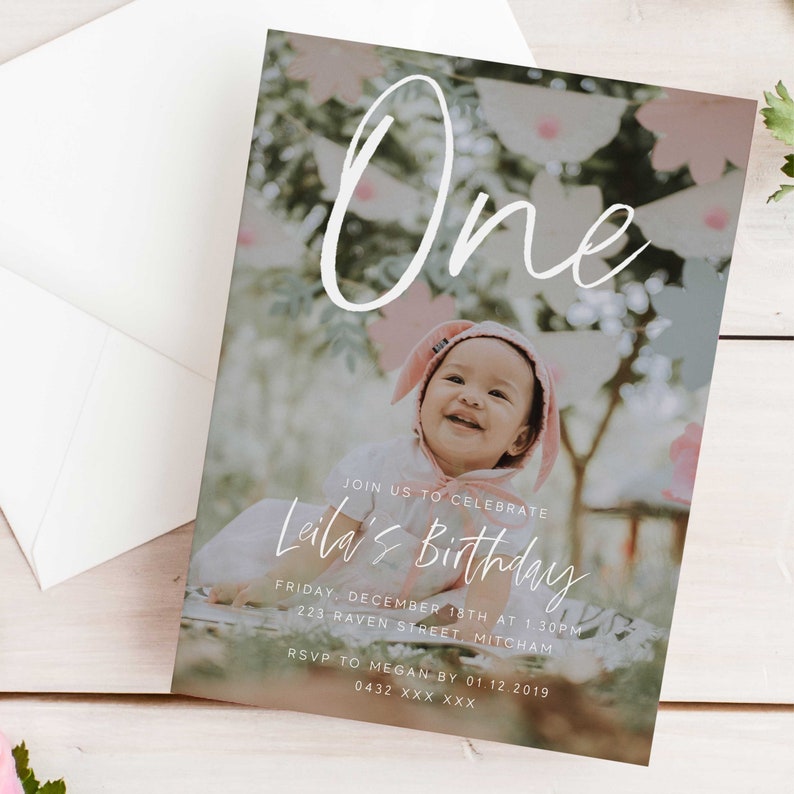 May include: A birthday invitation featuring a photo of a baby girl wearing a pink bunny hat. The invitation reads "One" and "Leila's Birthday" with the date and time of the party. RSVP details are provided.