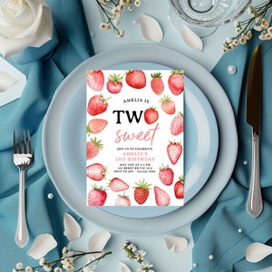a blue plate with a strawberry sweet birthday card on it