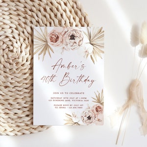 a white and pink floral wedding suite on a wicker place mat