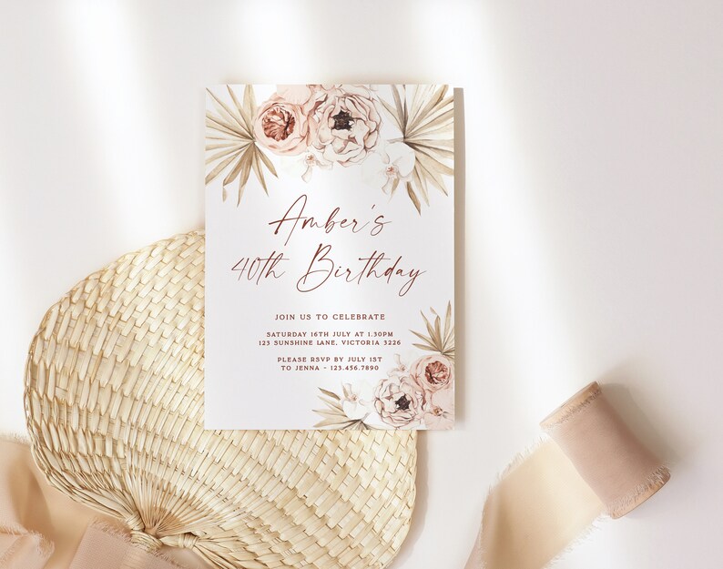 a white card with pink flowers on it