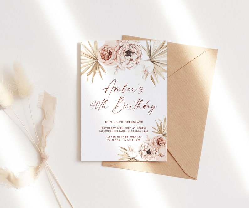 a white and gold birthday card with flowers on it