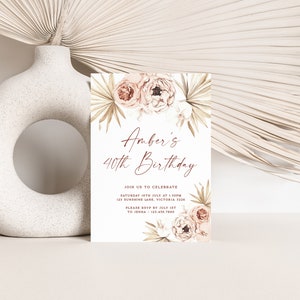 a white vase with a card on top of it