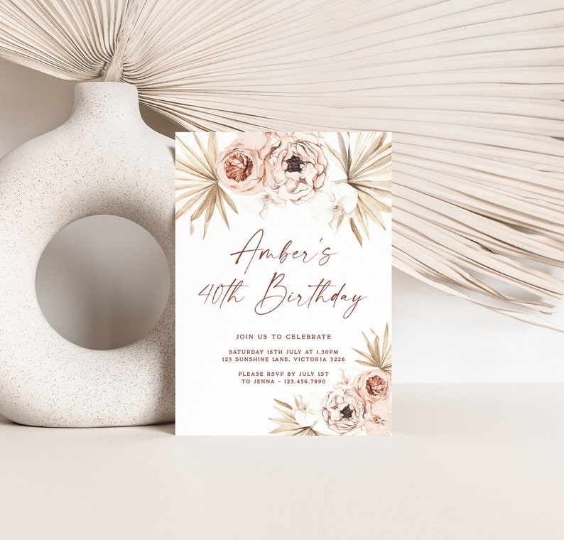 a white vase with a card on top of it