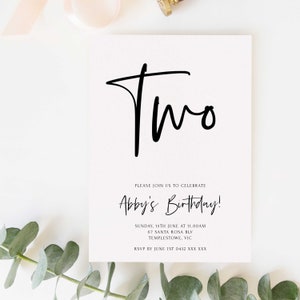 May include: A white invitation card with black calligraphy that says "Two" and "Abby's Birthday!" The invitation details a birthday party on Sunday, June 15th at 11:00 AM at 67 Santa Rosa Blvd, Templestowe, VIC. RSVP by June 1st to 0432 XXX XXX.