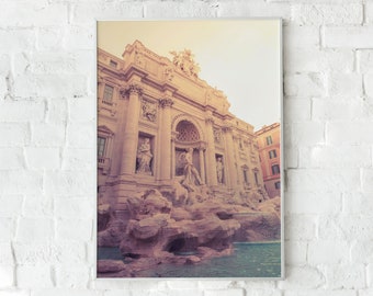 May include: A vintage-toned photograph of the Trevi Fountain in Rome, Italy. The fountain is a large, ornate structure with sculptures and water cascading down its facade.