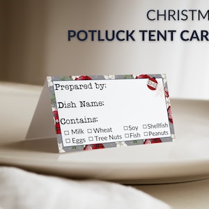 May include: A Christmas potluck tent card with a festive design. The card has spaces to write in the name of the dish, who prepared it, and what ingredients it contains. The card includes a checkbox list of common allergens, including milk, wheat, soy, shellfish, eggs, tree nuts, fish, and peanuts.