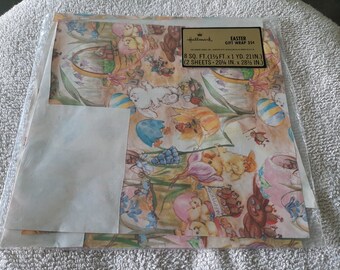 May include: A sheet of Easter-themed wrapping paper featuring a colorful design with chicks, bunnies, and eggs. The paper is 8 square feet and includes two sheets, each measuring 20 inches by 28 1/2 inches.