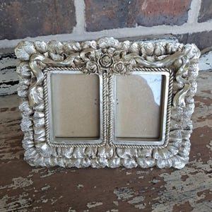 May include: A rustic wooden sign with the text "Welcome to our home" in white lettering. The sign features a distressed finish and a simple, inviting design, perfect for entryway decor.