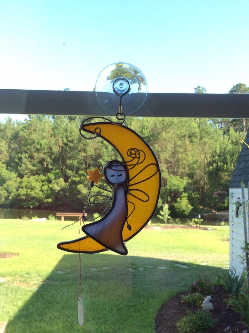 Fairy on crescent moon
