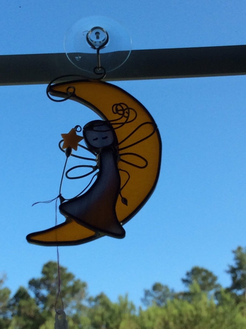 Fairy on crescent moon
