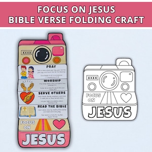 May include: A paper folding craft shaped like a camera, featuring sections titled PRAY, WORSHIP, SERVE OTHERS, and READ THE BIBLE with illustrations and text. Beside it is a black and white outline version of the same camera design with the text FOCUS ON JESUS.