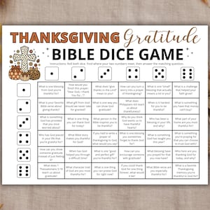 May include: A Thanksgiving Gratitude Bible Dice Game printable sheet featuring a grid with dice icons numbered one through six. The text includes instructions and various faith-based questions in each cell, decorated with a cross and pumpkins.