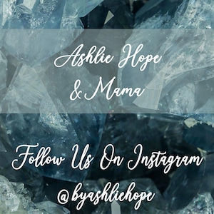May include: Image featuring a background of blue-toned crystals with white text overlay. The text reads "Ashlie Hope & Mama" and "Follow Us On Instagram @byashliehope". The overall aesthetic is clean and modern.