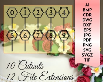 May include: Ten black hexagonal cake toppers with numbers 0 through 9, each with a star design around the perimeter. The toppers are on sticks and are arranged in two rows of five. The image also shows a white cake with pearl-like decorations and red roses.