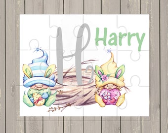 May include: A personalized Easter puzzle featuring two gnomes holding Easter treats. The puzzle is white with a gray letter H and the name Harry in green letters.