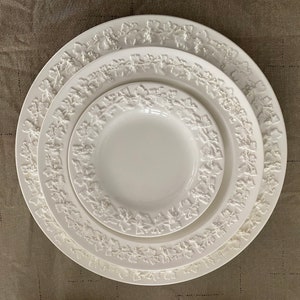 Stunning Wedgewood Etruria & Barlaston Queensware salad plates, bread plates, 6” soup bowls, cup and saucer and an ash tray.