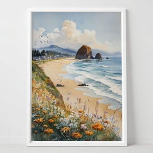 Könnte beinhalten: Aquarelldruck einer Küstenlandschaft mit Sandstrand, Meereswellen und einer großen Felsformation. Das Kunstwerk zeigt orangefarbene und weiße Wildblumen, einen blauen Himmel und flauschige Wolken. Das Bild ist in Weiß gerahmt.