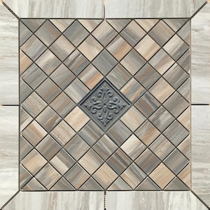 May include: A decorative tile floor with a diamond pattern in shades of brown, gray, and beige. A black and gray decorative tile is centered in the middle of the floor.