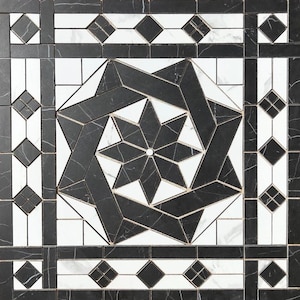May include: Geometric black and white tile design. The central pattern is a starburst shape with a white center and black angular lines. The border features diamond and square patterns. The tiles have a marble-like texture.