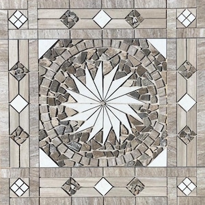 May include: Square mosaic tile with a central white starburst design. The starburst is surrounded by a circular pattern of small, irregularly shaped gray and brown tiles. The border features geometric patterns with diamonds and squares in neutral tones.