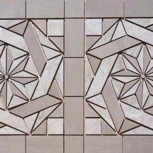 May include: Two gray square tiles with a geometric pattern of white and gray tiles. The pattern is a starburst design with a central point and radiating lines.