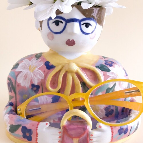 Pink shops and yellow woman planter pot