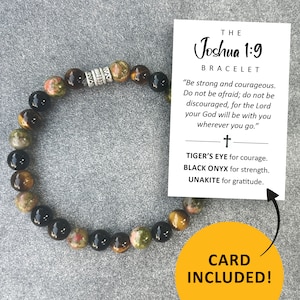 May include: A beaded bracelet featuring Tiger's Eye, Black Onyx, and Unakite stones. The bracelet includes a card with the text "The Joshua 1:9 Bracelet" and the phrase "Be strong and courageous." The card also states "CARD INCLUDED!"