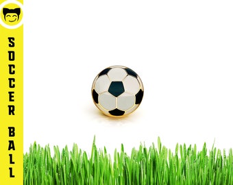 Young boy footballer pin badge Kicking a ball novelty lapel pin.