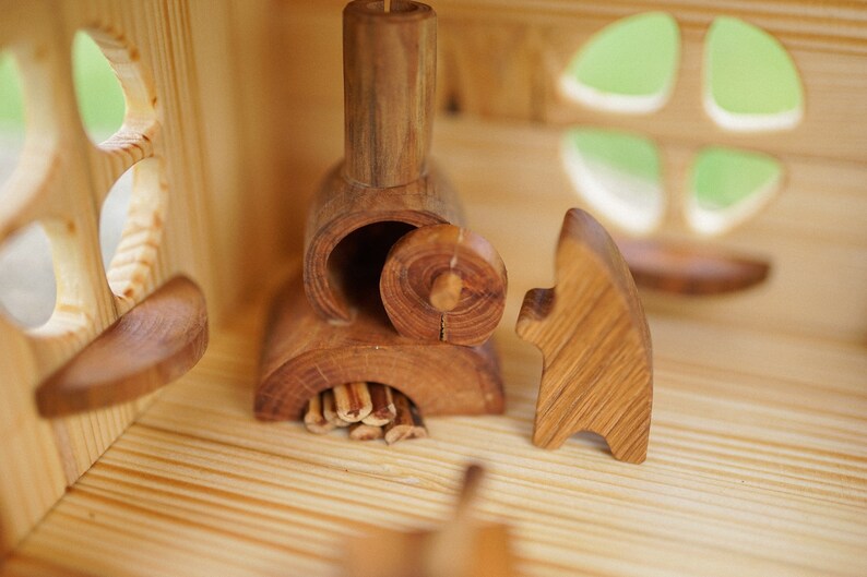 Threestory wooden Dollhouse with garden furniture and swings Etsy