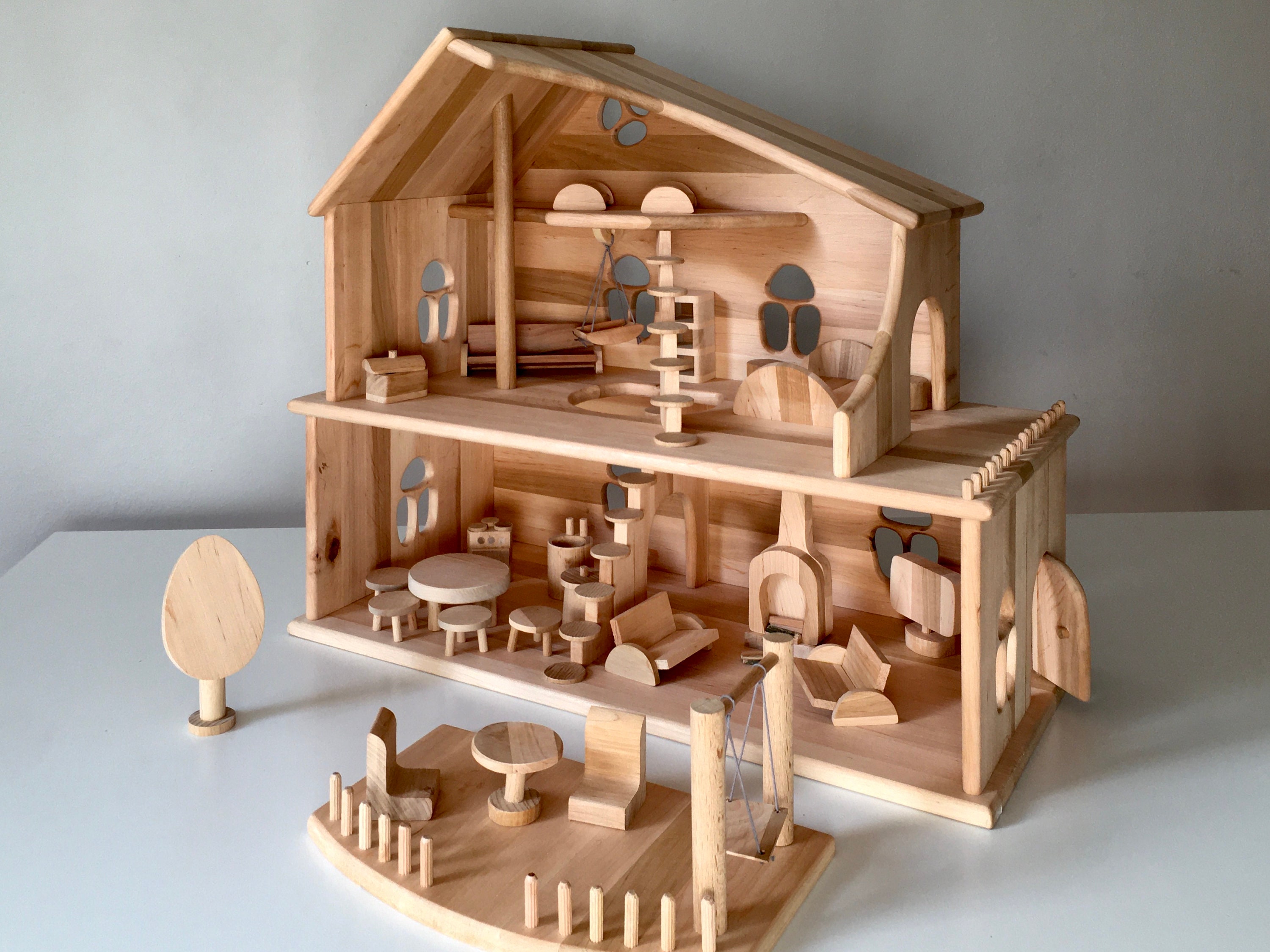 Threestory wooden Dollhouse with garden furniture and swings Etsy