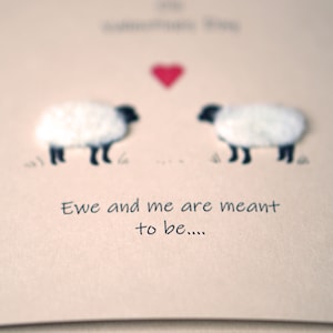 May include: A card with two white sheep facing each other with a red heart above them. The card says "Ewe and me are meant to be..."