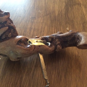 A vintage Reine Pedauque  corkscrew Made in France with grape vine handle.